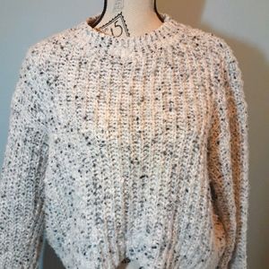 Cableknit sweater.